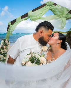 Bride and groom wedding first kiss at Salt River Beach in St Croix
