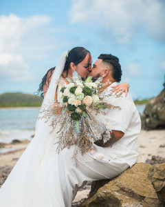 Bride and groom wedding first kiss at Salt River Beach in St Croix
