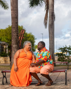 Black couple sharing an intimate moment at the clock tower in Frederiksted St Croix