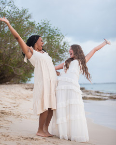 New graduates celebrating their accomplishments with a photoshoot on the beach in St Croix